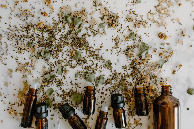 Amber bottles among dried herbs.